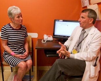 Marjorie Paulsen (left) discusses treatment for her brain tumor with Lawrence Recht, MD (right), one of the physicians at the Stanford Brain Tumor Center, which opens today.