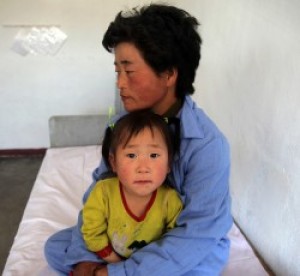 A mother and child in the WFP, WHO, UNICEF-supported Provincial Pediatric Hospital in Hamhung City, DPRK. Credit: OCHA/David Ohana