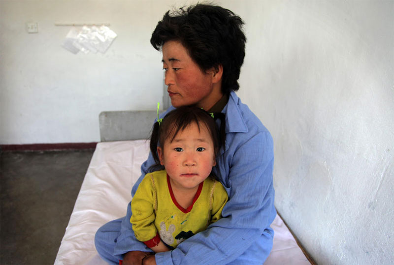 Mother and child at a UN-supported paediatric hospital in the Democratic People’s Republic of Korea